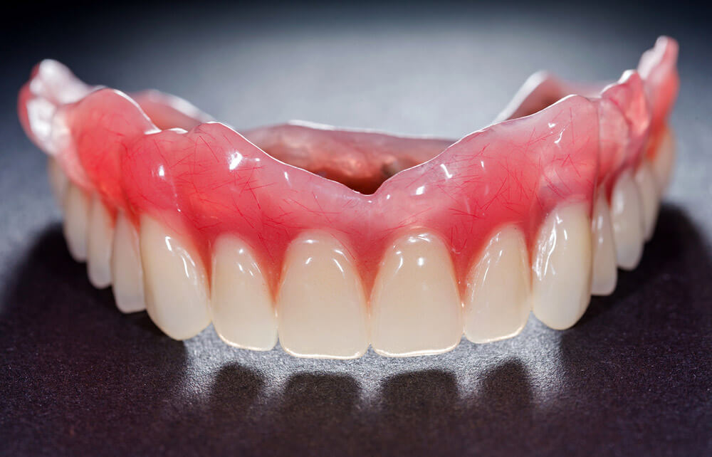 A Denture Adhesives that Keeps Loose-Fitting Dentures in Place